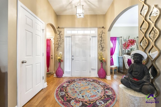 306 Lovorn Cir, Warner Robins, GA 31088 - entryway with arched walkways and wood finished floors