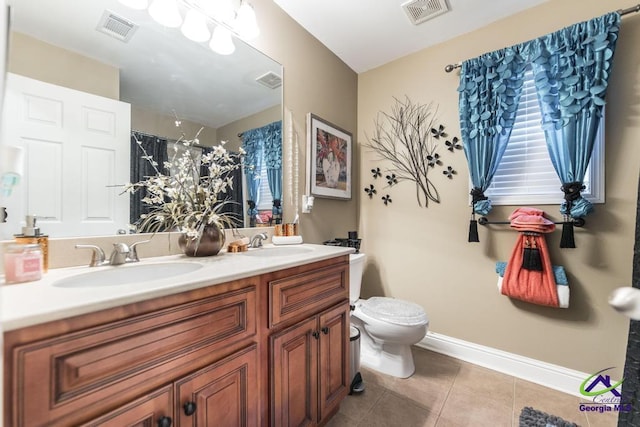 306 Lovorn Cir, Warner Robins, GA 31088 - bathroom featuring double vanity, tile patterned floors, toilet, a shower with shower curtain, and baseboards