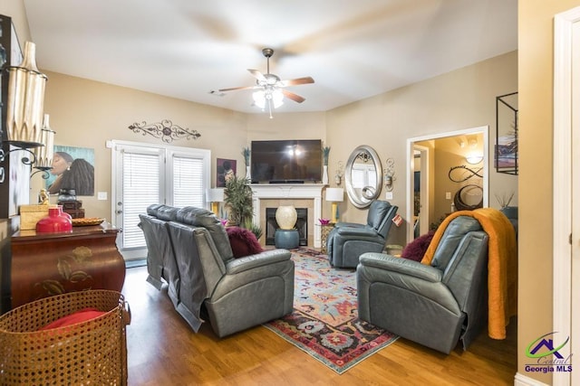 306 Lovorn Cir, Warner Robins, GA 31088 - living room with ceiling fan, wood finished floors, and a fireplace