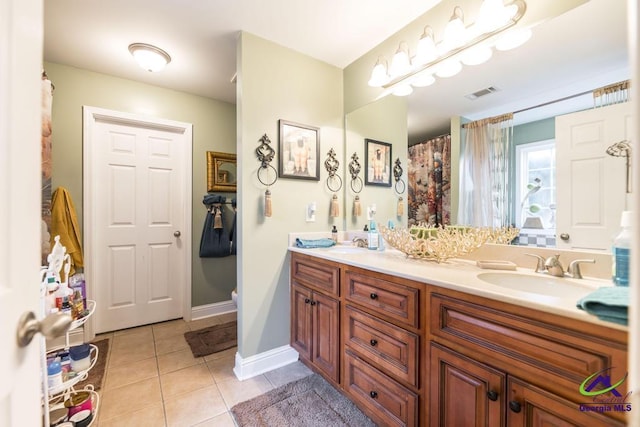 306 Lovorn Cir, Warner Robins, GA 31088 - full bathroom featuring double vanity, tile patterned floors, and baseboards