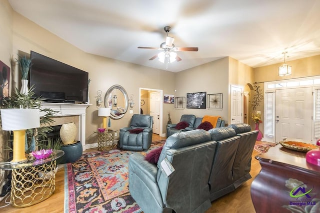 306 Lovorn Cir, Warner Robins, GA 31088 - living area with wood finished floors, ceiling fan, and a fireplace