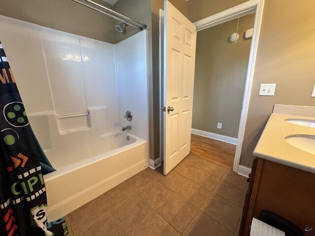 306 Lovorn Cir, Warner Robins, GA 31088 - bathroom with shower / bathtub combination with curtain, tile patterned flooring, vanity, and baseboards