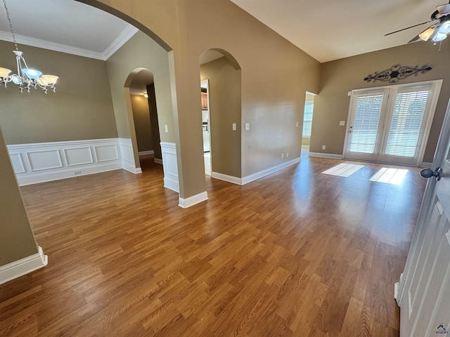 306 Lovorn Cir, Warner Robins, GA 31088 - empty room with ceiling fan, crown molding, wood finished floors, and a chandelier