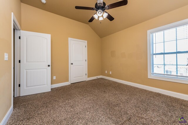 105 Reflection Dr, Bonaire, GA 31005 - unfurnished bedroom featuring ceiling fan, carpet floors, and vaulted ceiling