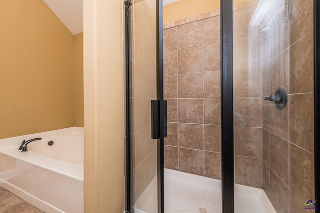 105 Reflection Dr, Bonaire, GA 31005 - bathroom featuring lofted ceiling and separate shower and tub