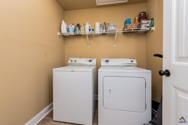 105 Reflection Dr, Bonaire, GA 31005 - washroom featuring light tile patterned flooring and washing machine and clothes dryer