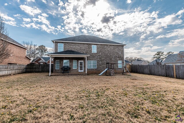 105 Reflection Dr, Bonaire, GA 31005 - back of property with a yard and a playground