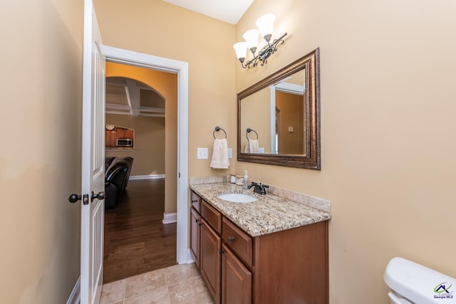 105 Reflection Dr, Bonaire, GA 31005 - bathroom with coffered ceiling, vanity, toilet, and beamed ceiling