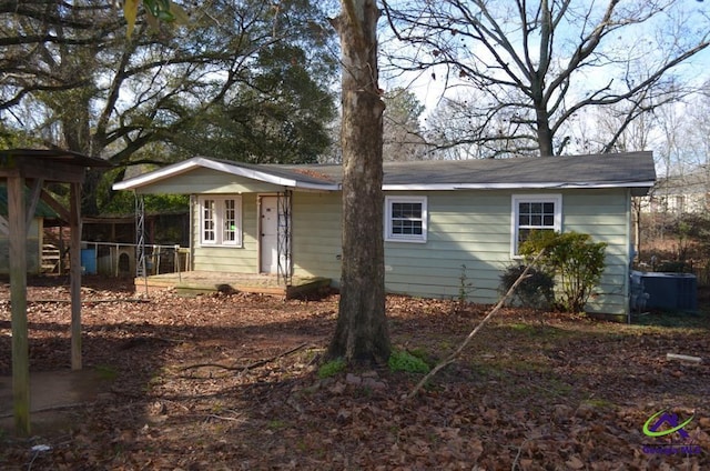 single story home featuring central AC unit