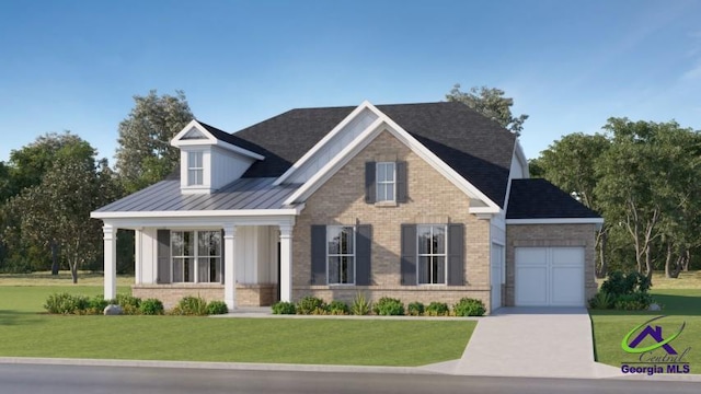 view of front of house with a garage and a front yard