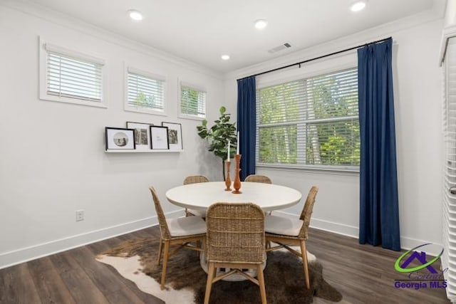 223 Flat Shoals Dr, Bonaire, GA 31005 - dining space featuring crown molding and dark hardwood / wood-style floors