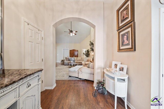 interior space featuring dark hardwood / wood-style flooring and vaulted ceiling