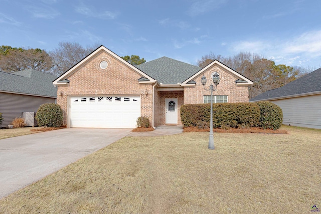 view of front of house featuring a garage and a front yard