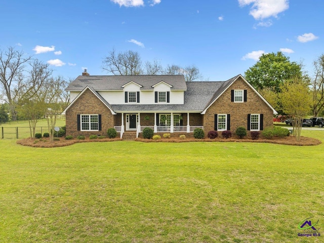 view of front facade featuring a front lawn and covered porch