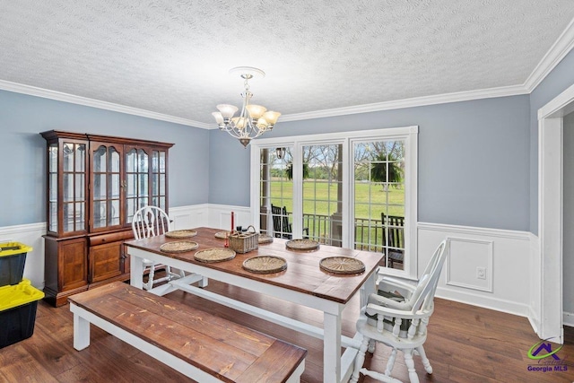 dining room with plenty of natural light, dark wood-type flooring, and a chandelier