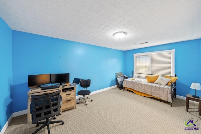 carpeted bedroom featuring a textured ceiling