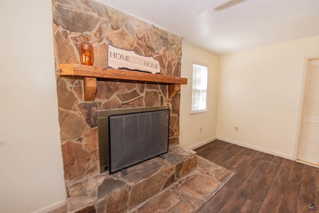 living room featuring dark hardwood / wood-style flooring and a fireplace