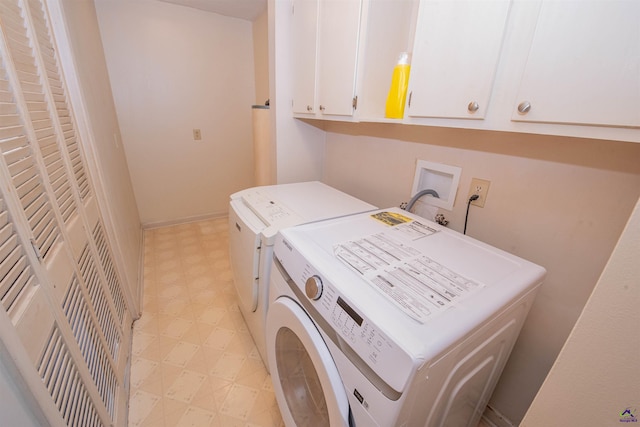 laundry area featuring cabinets and independent washer and dryer