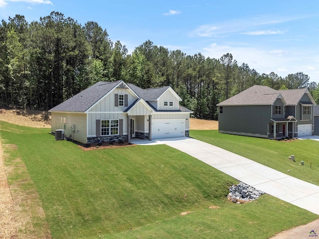 687 Jasmine Dr, Macon, GA 31211 - modern inspired farmhouse featuring board and batten siding, central AC unit, concrete driveway, and a front lawn