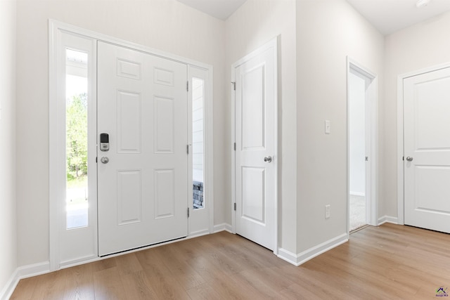 687 Jasmine Dr, Macon, GA 31211 - foyer entrance with light wood-style floors and baseboards