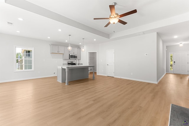 687 Jasmine Dr, Macon, GA 31211 - unfurnished living room featuring recessed lighting, light wood-style flooring, a ceiling fan, baseboards, and a sink