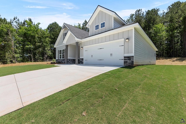 687 Jasmine Dr, Macon, GA 31211 - view of property exterior featuring board and batten siding, concrete driveway, a lawn, and stone siding