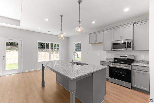 687 Jasmine Dr, Macon, GA 31211 - kitchen with stainless steel appliances, a sink, gray cabinets, recessed lighting, and light stone counters