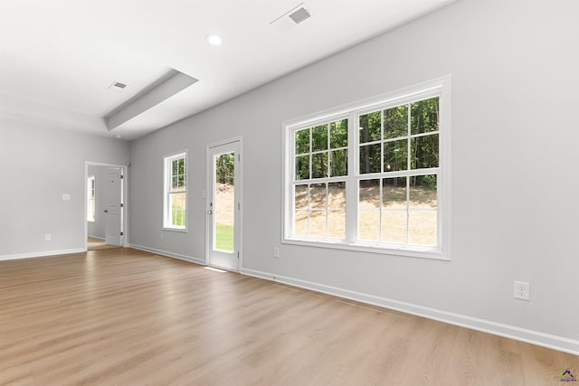 687 Jasmine Dr, Macon, GA 31211 - empty room featuring light wood-style floors, baseboards, recessed lighting, and a raised ceiling