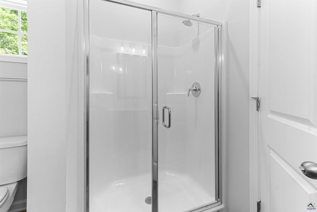 687 Jasmine Dr, Macon, GA 31211 - bathroom featuring toilet and a shower stall