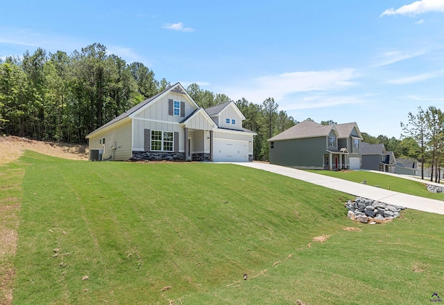 687 Jasmine Dr, Macon, GA 31211 - modern inspired farmhouse featuring board and batten siding, driveway, central AC unit, a front lawn, and an attached garage