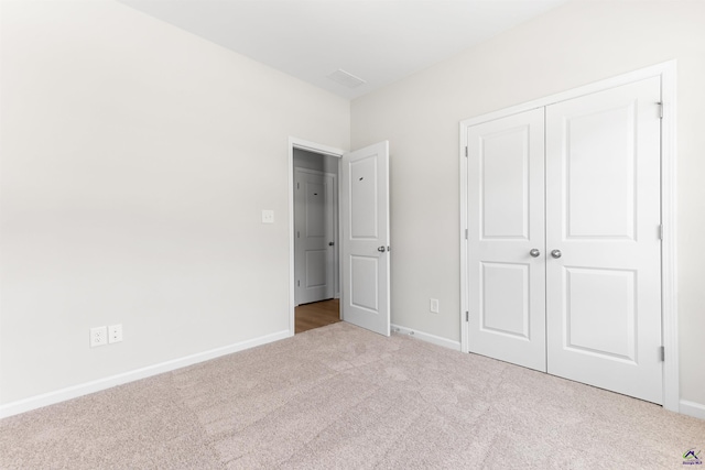 687 Jasmine Dr, Macon, GA 31211 - unfurnished bedroom featuring carpet flooring, baseboards, and a closet
