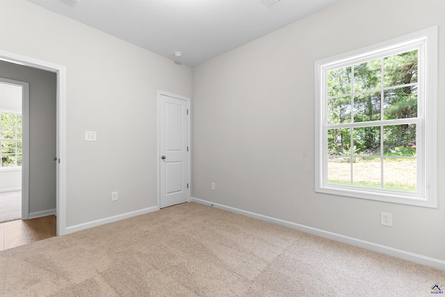 687 Jasmine Dr, Macon, GA 31211 - carpeted empty room featuring baseboards