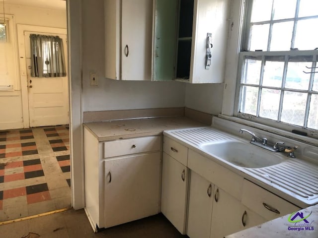 kitchen with sink and white cabinets