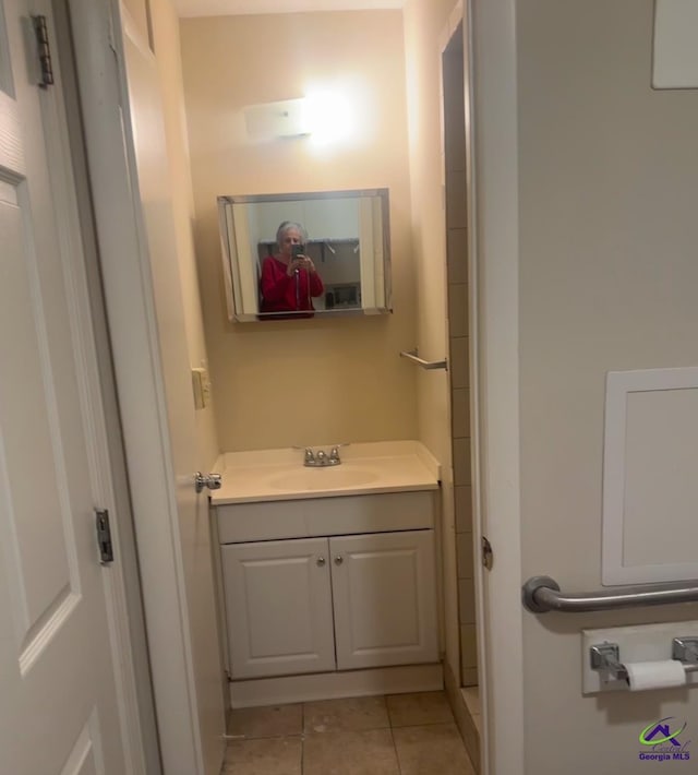 bathroom with tile patterned floors and vanity