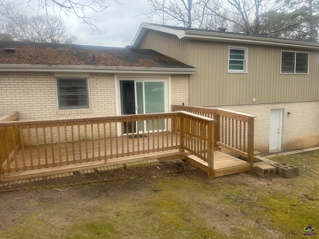 back of house featuring a wooden deck