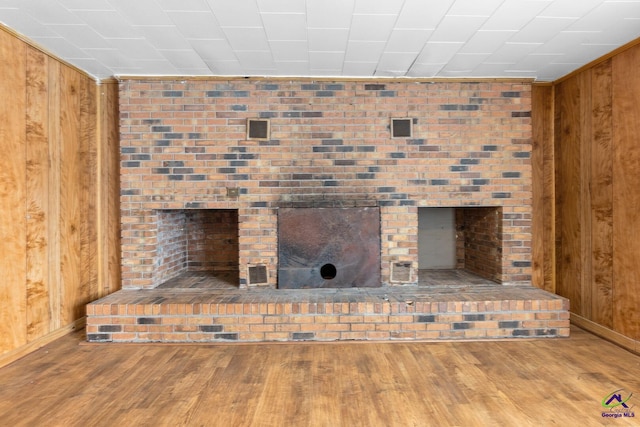 details with wooden walls and wood-type flooring