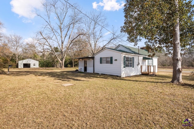 view of side of home featuring a yard