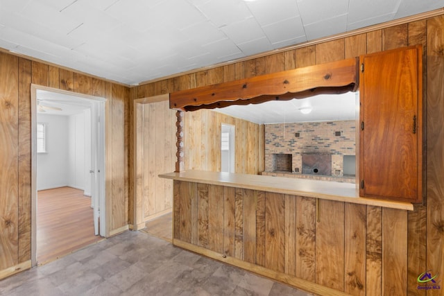 kitchen with wooden walls and kitchen peninsula