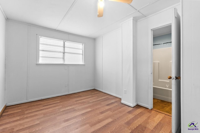 unfurnished bedroom with ceiling fan and light hardwood / wood-style floors