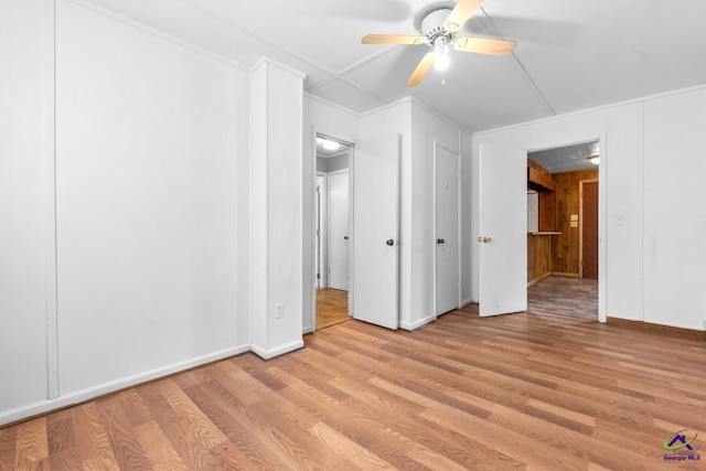 unfurnished room featuring ceiling fan and light wood-type flooring