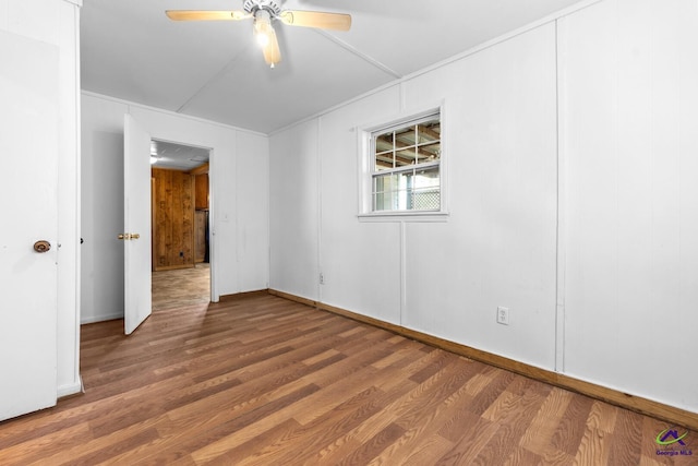 unfurnished room featuring hardwood / wood-style floors and ceiling fan