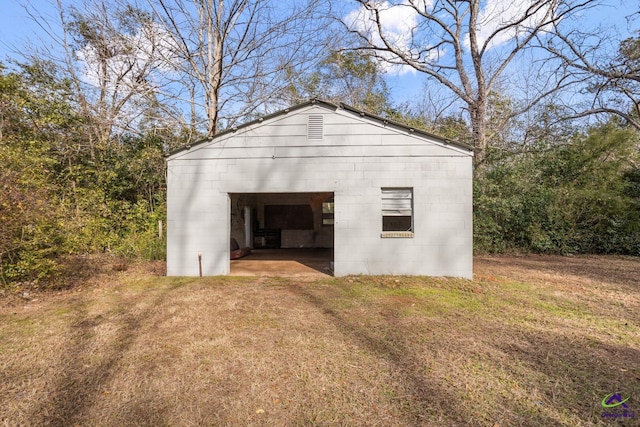 garage with a yard