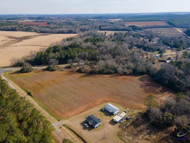 birds eye view of property with a rural view