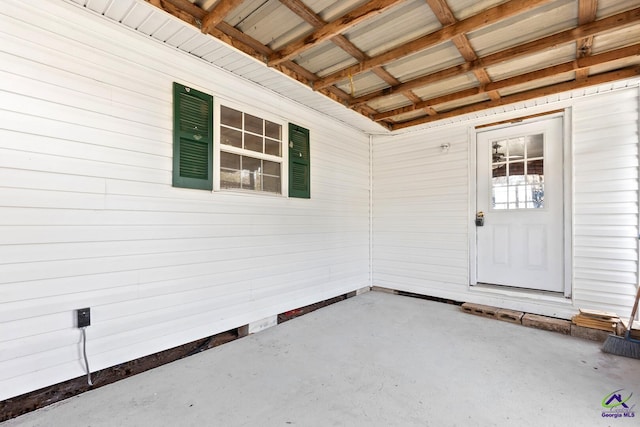 doorway to property featuring a patio area