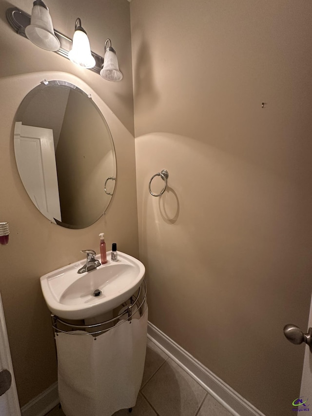 bathroom featuring tile patterned flooring and sink