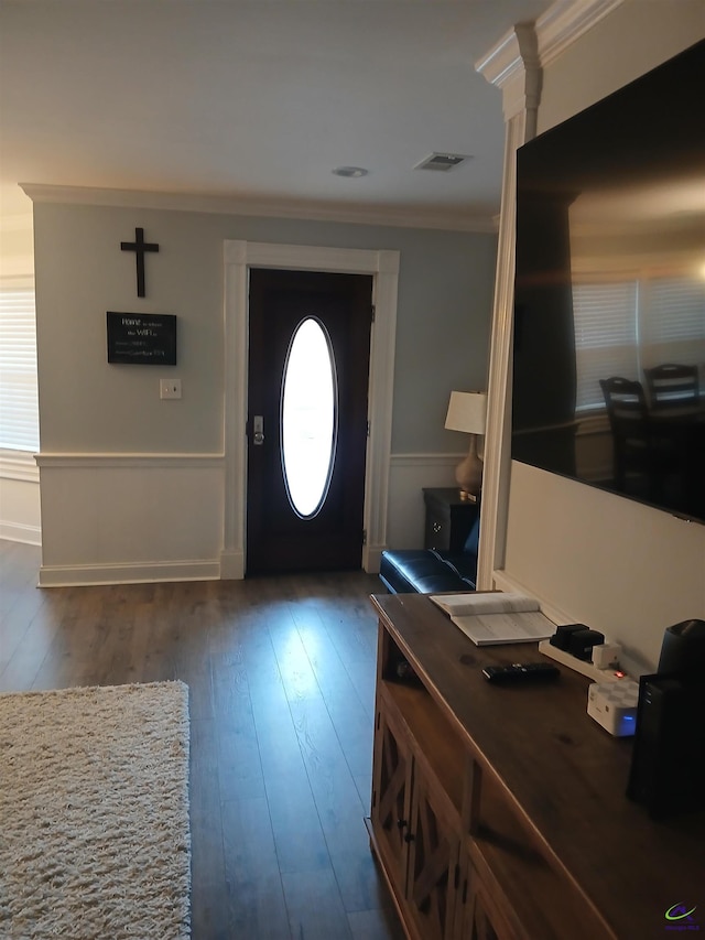 entryway featuring crown molding and dark wood-type flooring