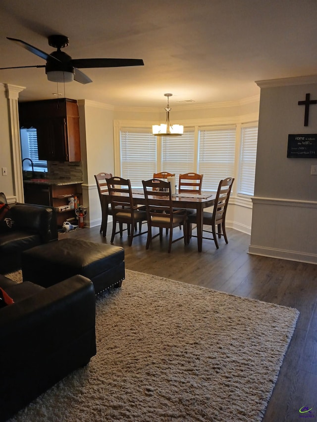 living room featuring ornamental molding, dark hardwood / wood-style floors, and ceiling fan