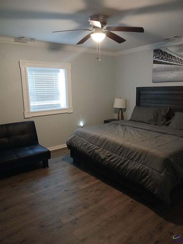 bedroom with ceiling fan, ornamental molding, and dark hardwood / wood-style floors