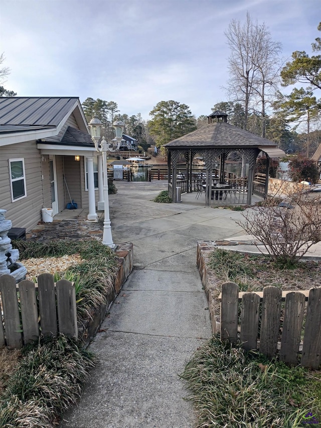 view of property's community featuring a gazebo and a water view