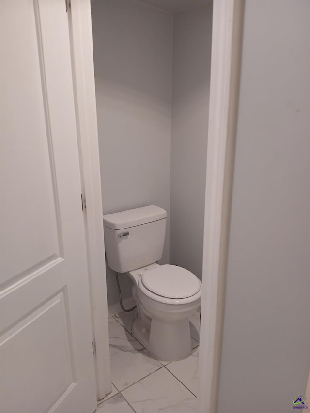 bathroom featuring toilet